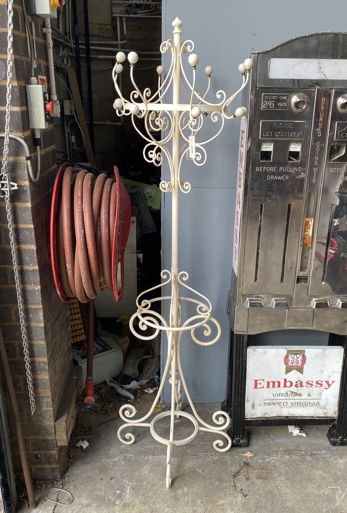 A painted metal coat and stick stand, height 184cm